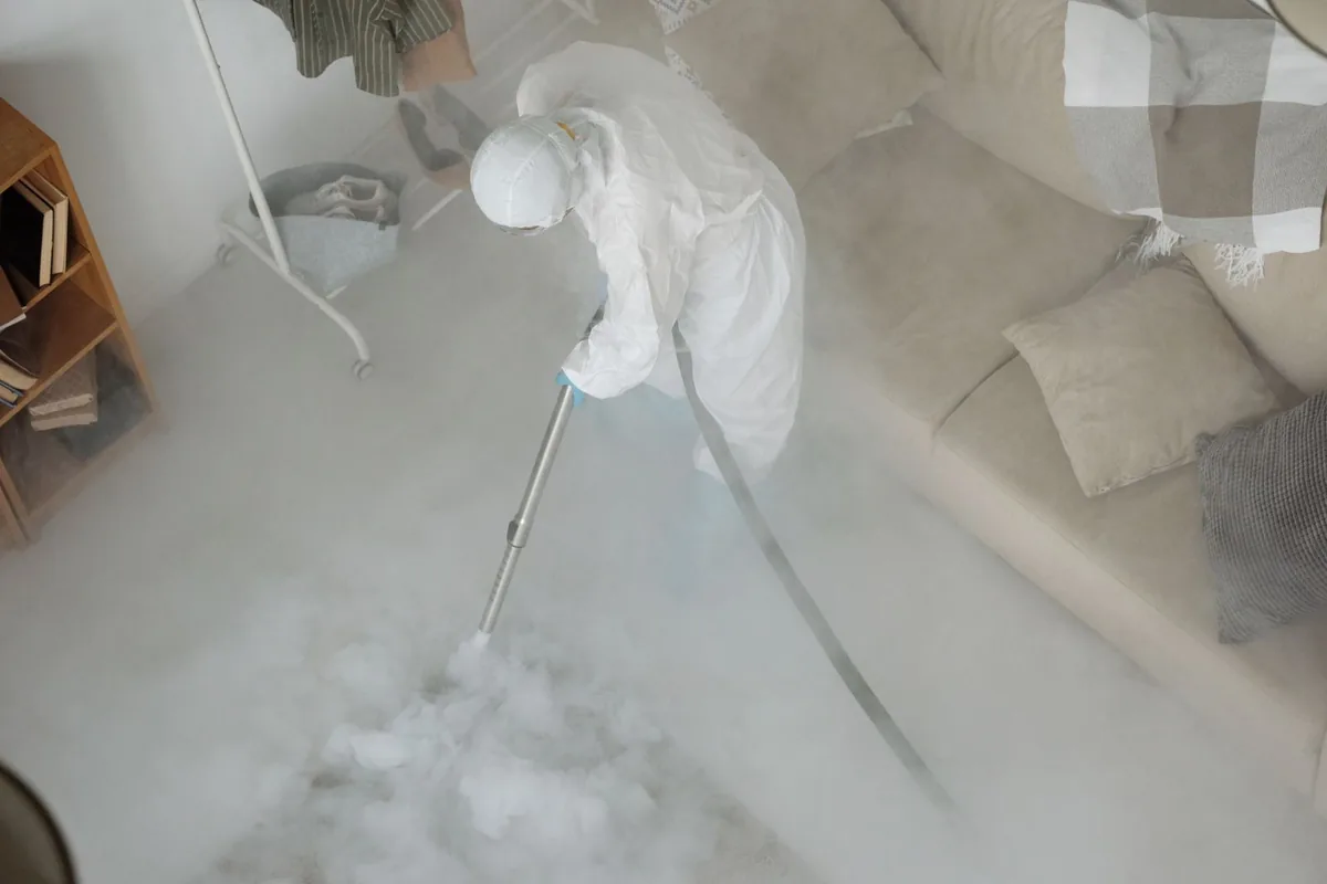 Biohazard cleanup technician in protective equipment, Moscow Mills, MO